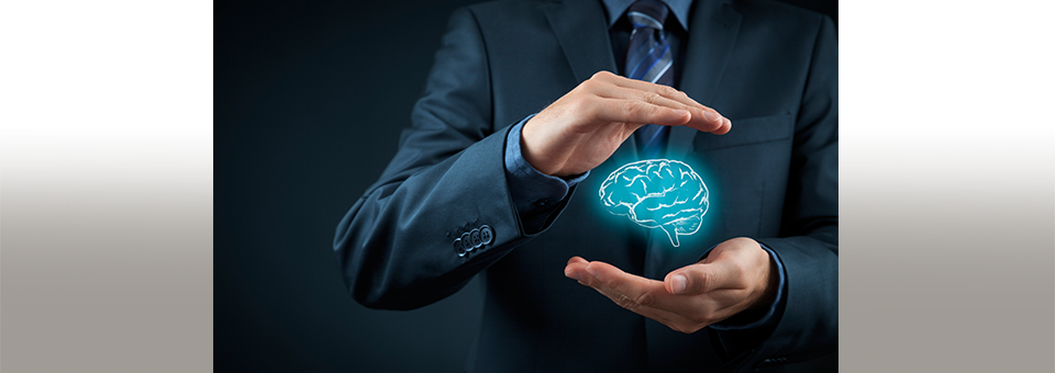 image of the hands of a businessman cradling a graphic image of a brain, to illustrate protecting intellectual property