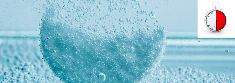 medicine tablet dissolving in water with stopwatch showing 30 seconds